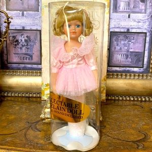 Porcelain Doll with stand.